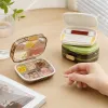 Transparent compartments medicine box with green base, white lid, storage box, cotton swabs, band-aids and pink tablets details Picture